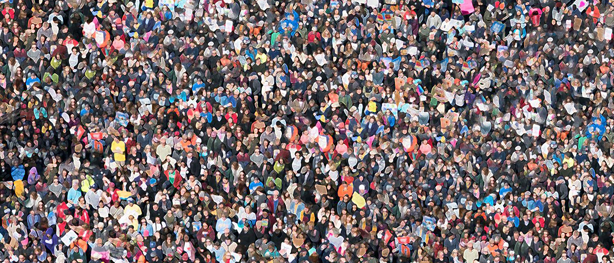 Pixelated photograph looking down on a crowd of people